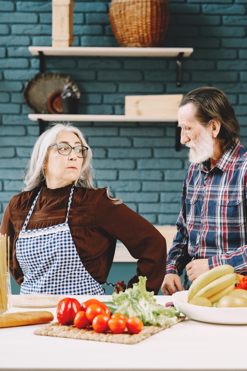 an elderly couple in the kitchen